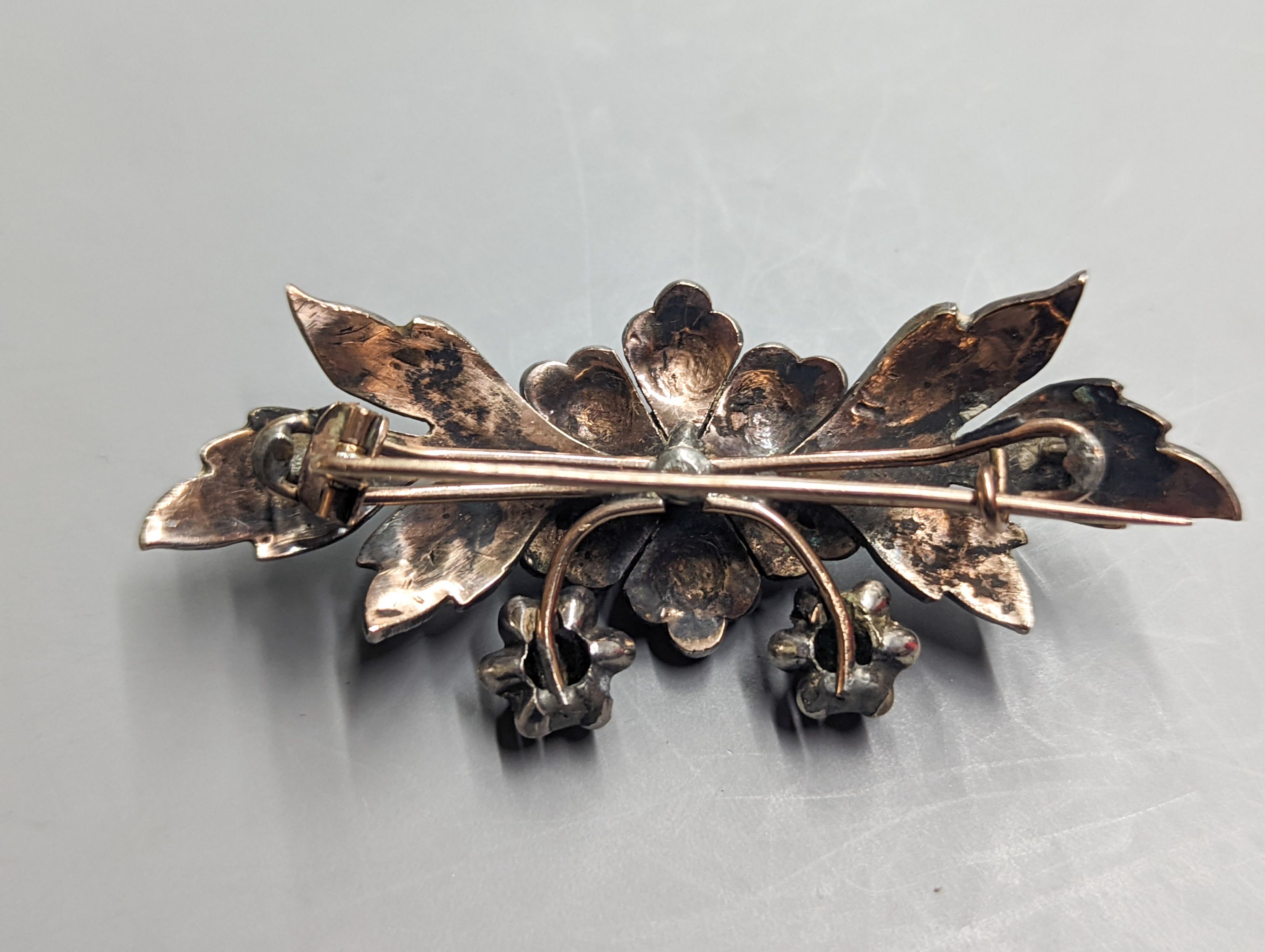 A 19th century continental white and yellow metal , rose cut diamond set floral spray brooch, 71mm, gross weight 21.7 grams.